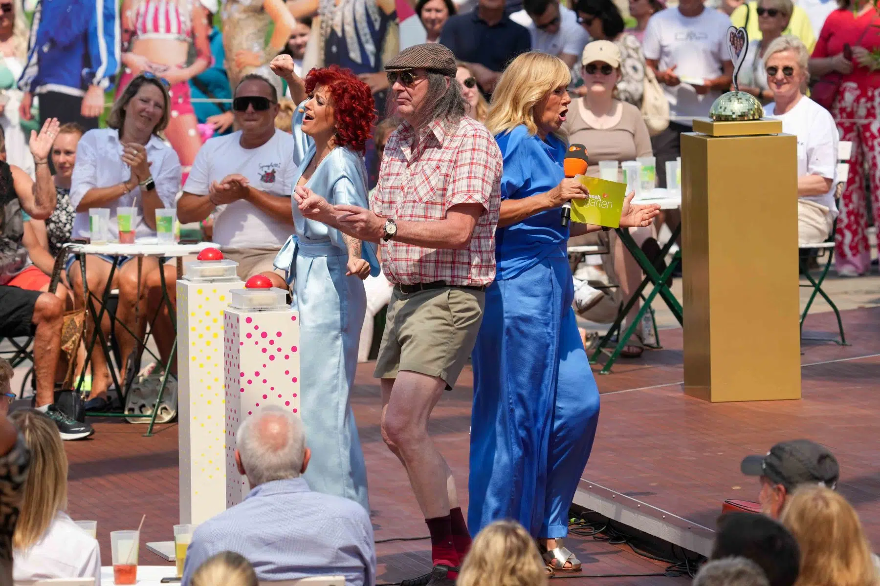 Moderatorin Andrea Kiwi Kiewel, Sängerin Lucy Diakovska & Sänger Guildo Horn in der Unterhaltungsshow ZDF Fernsehgarten am 12.05.2024 in Mainz. Moderatorin Andrea Kiwi Kiewel, Sängerin Lucy Diakovska & Sänger Guildo Horn in der Unterhaltungsshow ZDF Fernsehgarten am 12.05.2024 in Mainz.